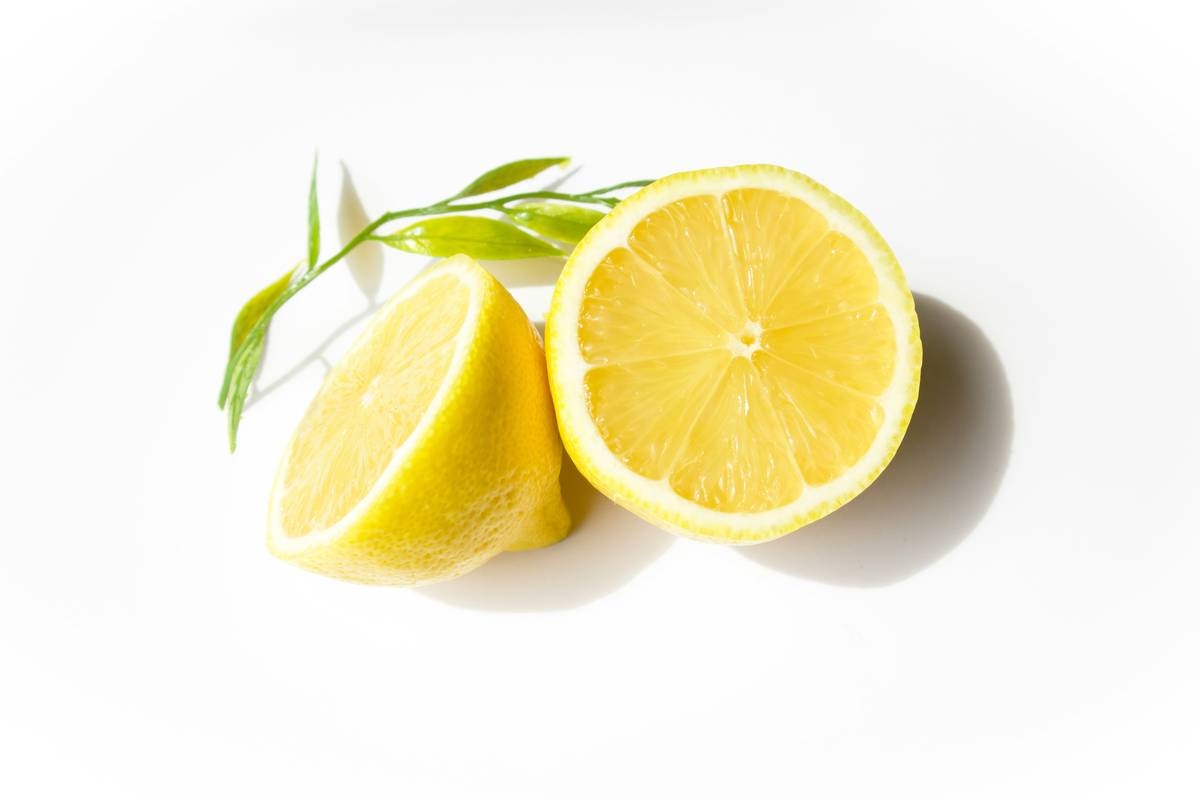 Woman preparing lemon rest aid tea in dim evening light for better sleep